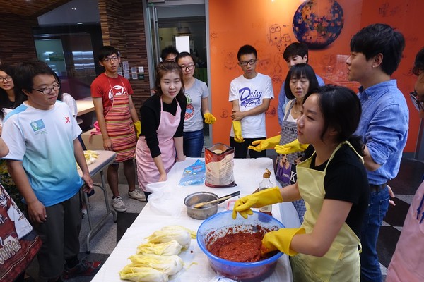 Students learning to make kimchi